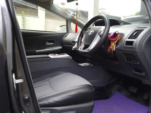 Toyota Prius Alpha Car For Rent.